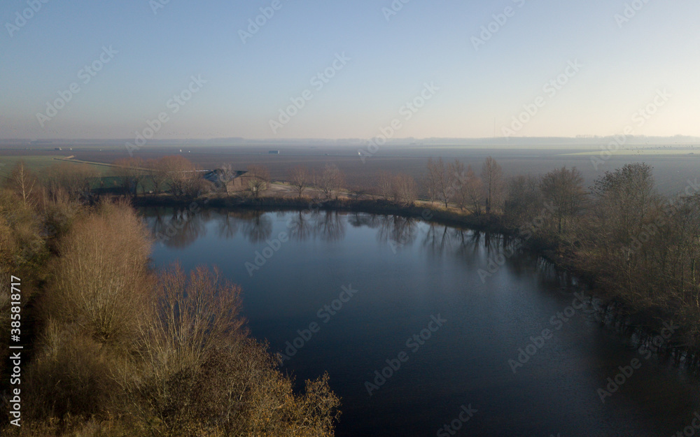 Aerial view of a lake, on a cold, winter day