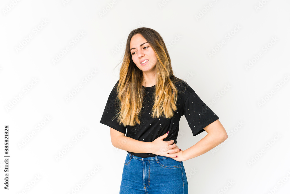 Young caucasian woman isolated on white background having a liver pain, stomach ache. Young caucasian woman isolated on white background having a liver pain, stomach ache.