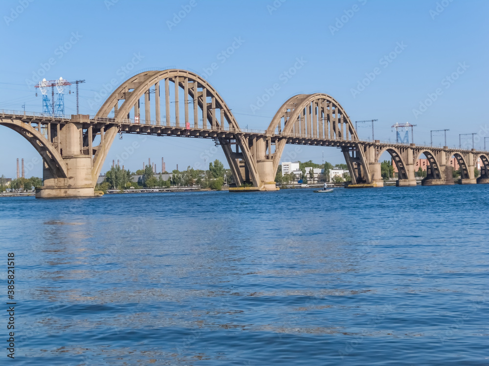 stony bridge over a river, urban city scene