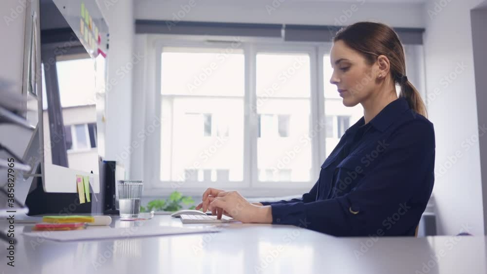 Businesswoman working with computer at small office Businesswoman working with computer at small office