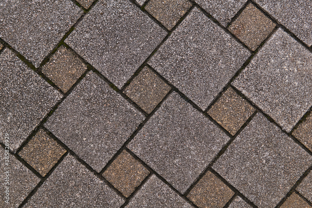 fragment of sidewalk from square tiles of different sizes fragment of sidewalk from square tiles of different sizes