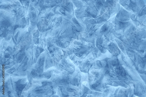 Blue ice background. Frozen water.