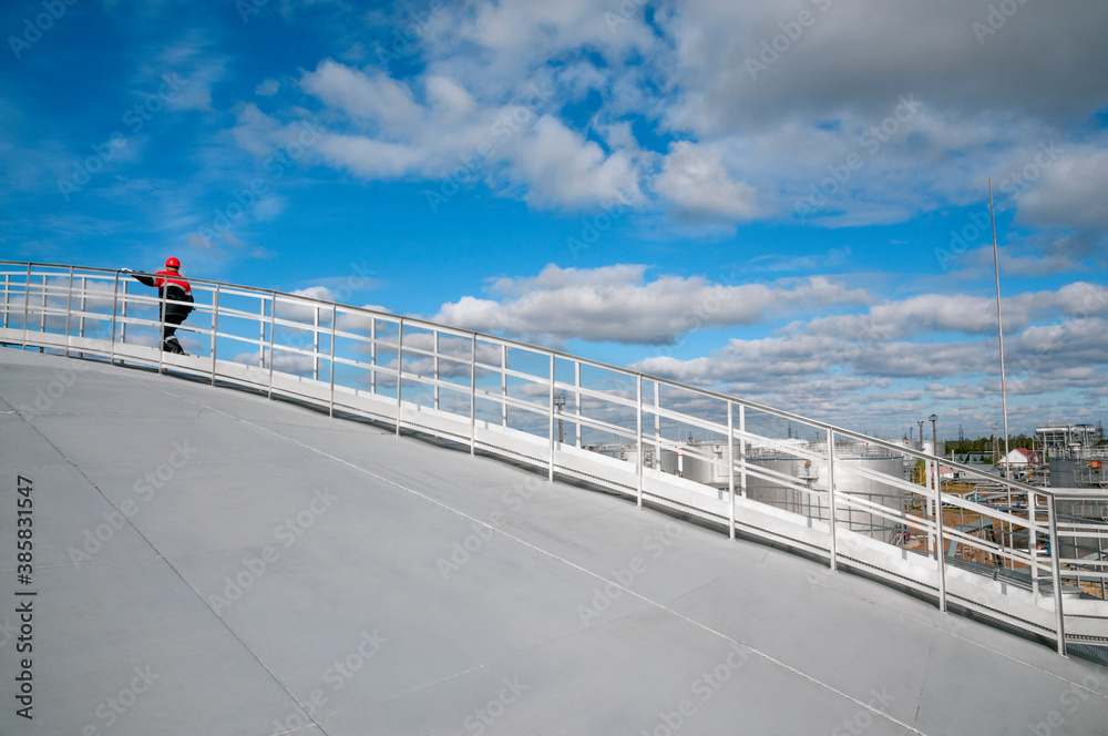 Ladder to the oil tank. Oil and gas industry, oil refinery. Ladder to the oil tank. Oil and gas industry, oil refinery.