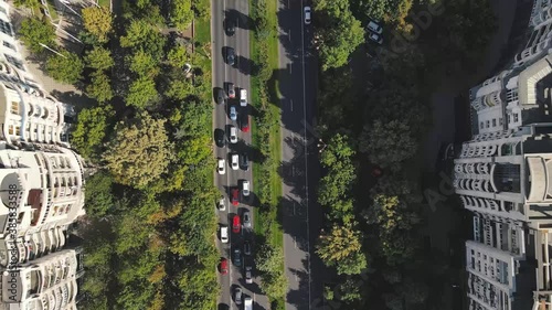 aerial view of a green boulevard with traffic
