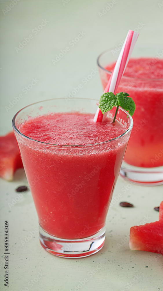Fresh fresh juice of ripe watermelon in a beautiful glass with a Fresh fresh juice of ripe watermelon in a beautiful glass with a