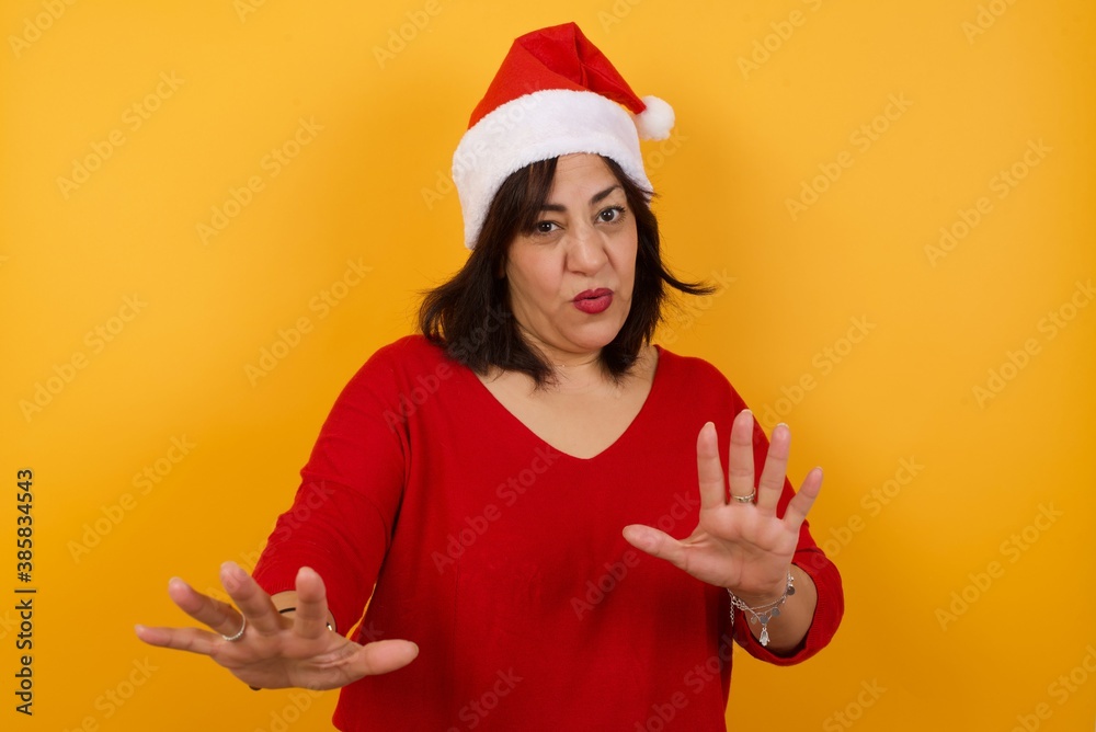 Beautiful brunette girl over isolated background afraid and terrified with fear, and disgusted expression stop gesture with both hands saying: Stay there. Panic concept. Beautiful brunette girl over isolated background afraid and terrified with fear, and disgusted expression stop gesture with both hands saying: Stay there. Panic concept.