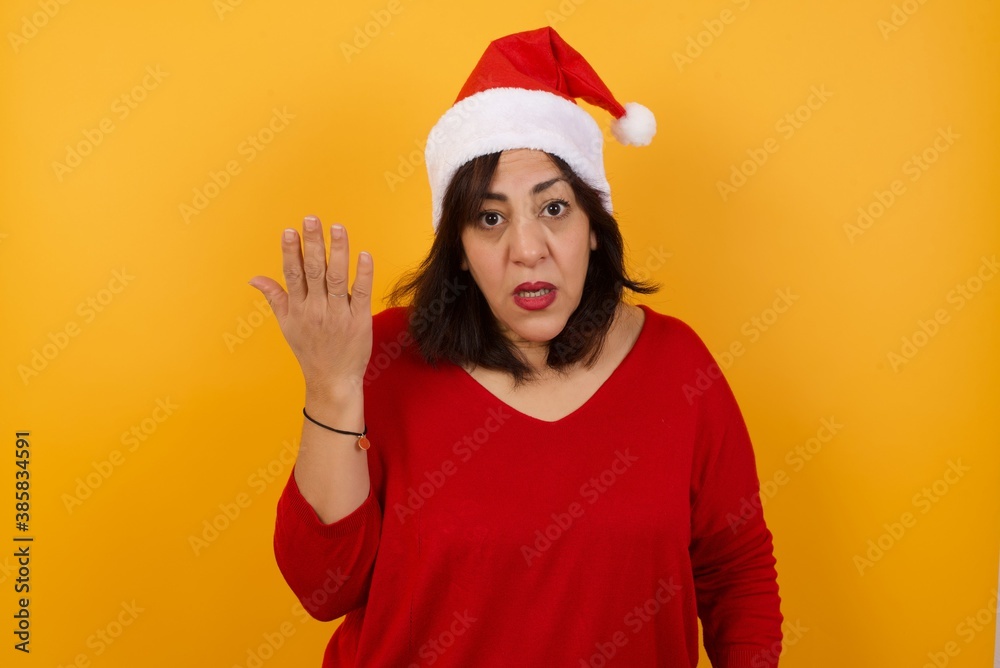 What the hell are you talking about, nonsense. Studio shot of frustrated female with blonde hair gesturing with raised palm, frowning, being displeased and confused with dumb question over gray wall. What the hell are you talking about, nonsense. Studio shot of frustrated female with blonde hair gesturing with raised palm, frowning, being displeased and confused with dumb question over gray wall.