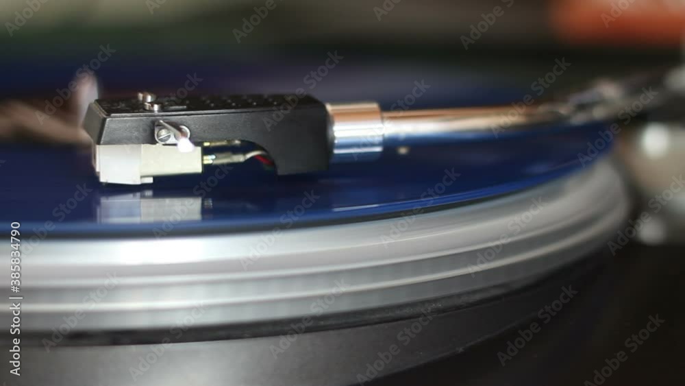 old blue vinyl record with clipping path. DJ Turntable with Vinyl Record, Playing, Top View. Close up at the needle on turntable old blue vinyl record with clipping path. DJ Turntable with Vinyl Record, Playing, Top View. Close up at the needle on turntable