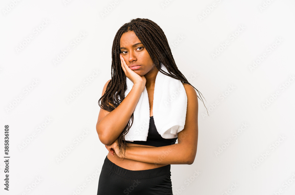 Young african american sport woman isolated who is bored, fatigued and need a relax day. Young african american sport woman isolated who is bored, fatigued and need a relax day.