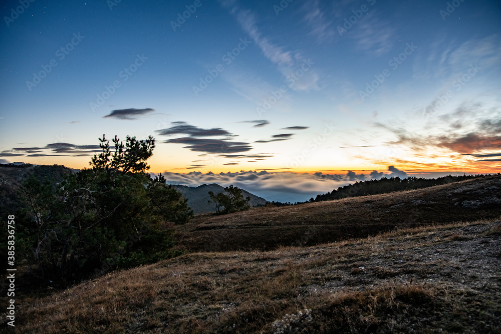 sunrise in the mountains with morning fog from early autumn sunrise in the mountains with morning fog from early autumn