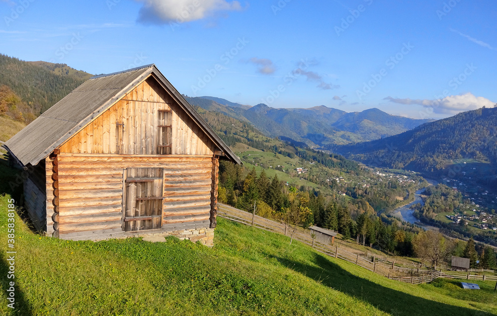 Single house on the hill of mountains.