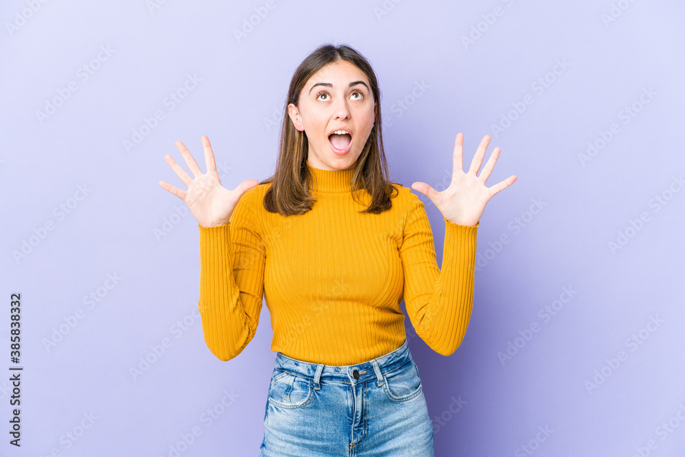 Young caucasian woman screaming to the sky, looking up, frustrated. Young caucasian woman screaming to the sky, looking up, frustrated.