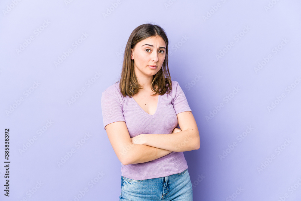 Young caucasian woman suspicious, uncertain, examining you. Young caucasian woman suspicious, uncertain, examining you.