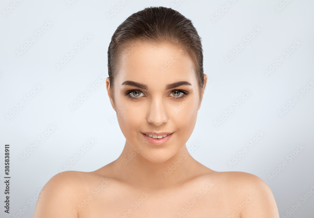 Portrait of a attractive brunette girl with healthy clean skin and fresh make-up. Aesthetic cosmetology and makeup concept. Portrait of a attractive brunette girl with healthy clean skin and fresh make-up. Aesthetic cosmetology and makeup concept.