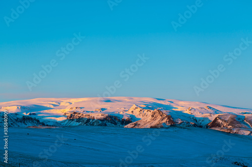 Iceland s incredible mountain landscape in winter. Mountains in the snow. Large spaces. The beauty of winter nature