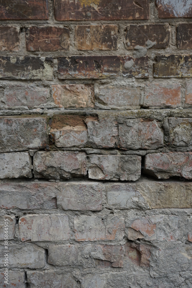 Brick wall. Texture. Background from old bricks. Vertical image Brick wall. Texture. Background from old bricks. Vertical image