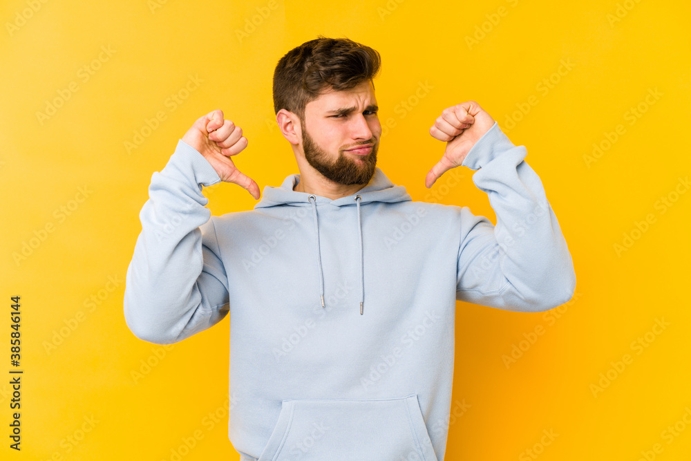 Fototapeta premium Young caucasian man isolated on yellow background feels proud and self confident, example to follow.