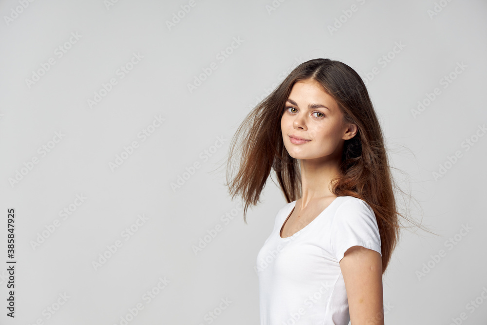 brunette woman smiling on a light background Copy Space brunette woman smiling on a light background Copy Space