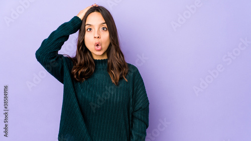 Young mixed race hispanic woman isolated being shocked, she has remembered important meeting. © Asier