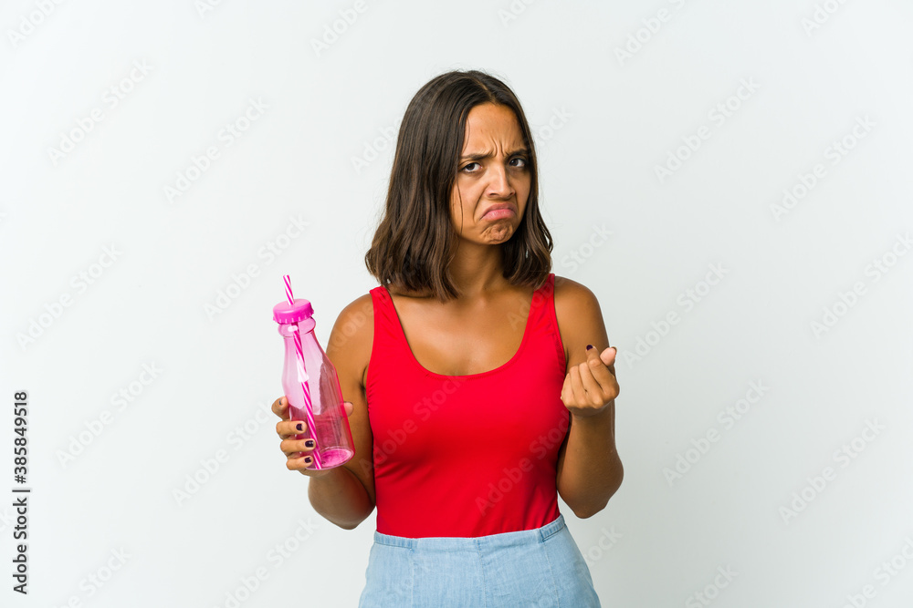Young latin woman holding a milkshake isolated on white background Young latin woman holding a milkshake isolated on white background
