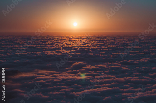 sunset over the clouds photo