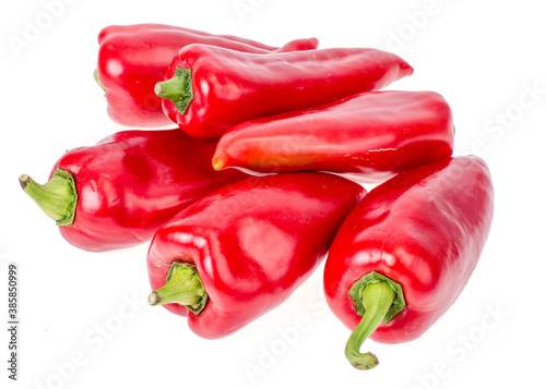 Pile of red ripe sweet organic peppers isolated on white background