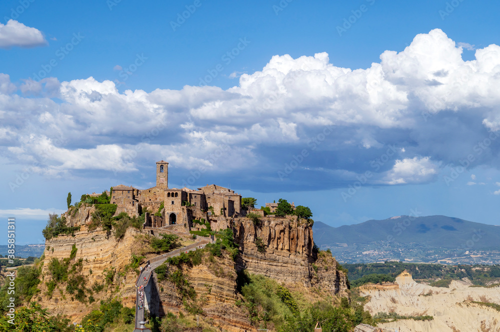 Picturesque panoramic of medieval Civita di Bagnoregio, the village in the clouds. This village, known as The Dying Town, is located on the top of a plateau of volcanic tuff, Viterbo, Lazio, Italy.