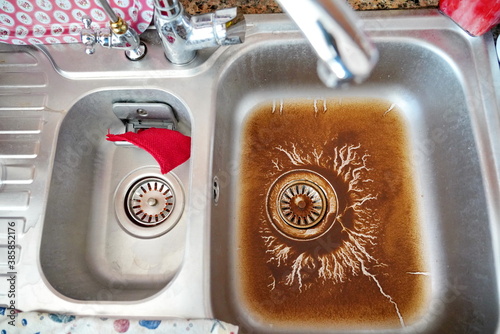Fototapeta Naklejka Na Ścianę i Meble -  clogged kitchen sink at home