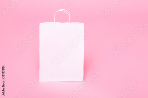 white paper bag for logo on a pink background