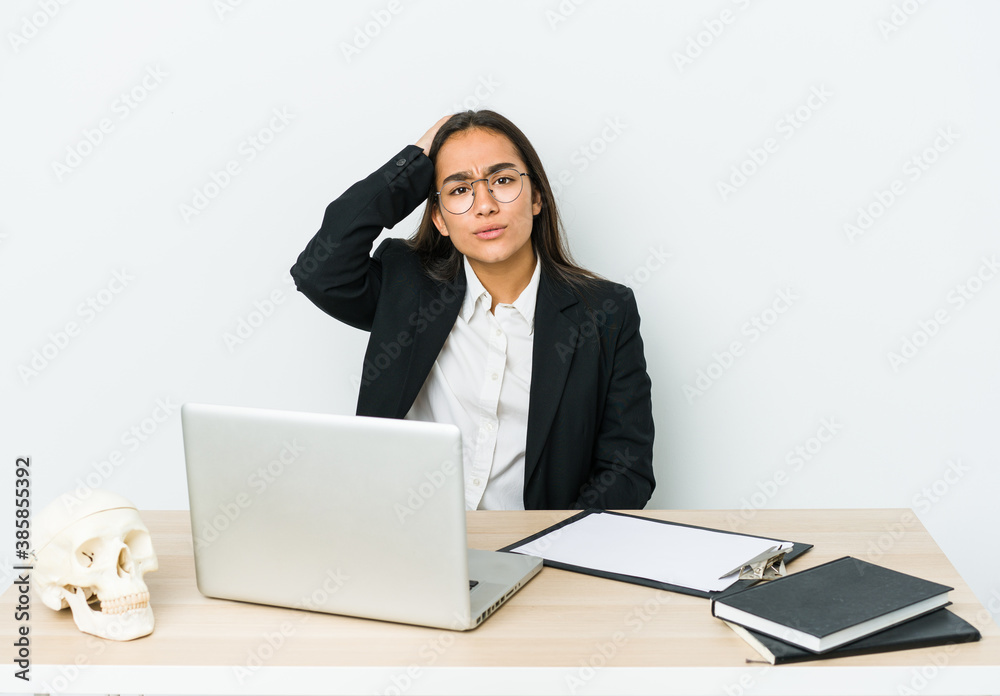Young traumatologist asian woman isolated on white background tired and very sleepy keeping hand on head. Young traumatologist asian woman isolated on white background tired and very sleepy keeping hand on head.