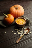 Fresh autumn pumpkins with pumpkin soup