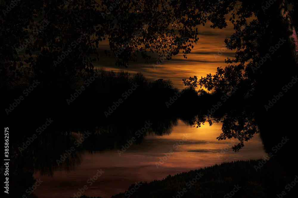 Fototapeta premium sunset over the river