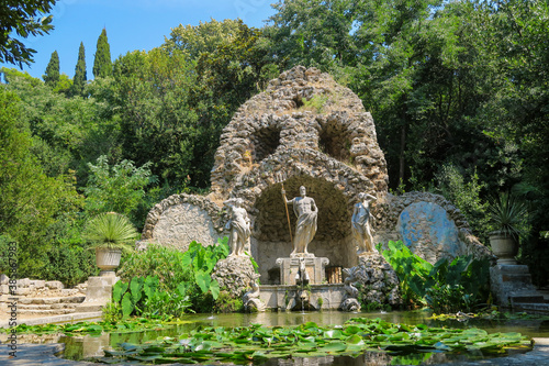 Statues spouting water in the beautiful garden of Trsteno arboretum in Croatia