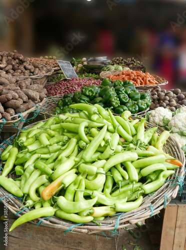 Green peppers and other vegetables in the market photo