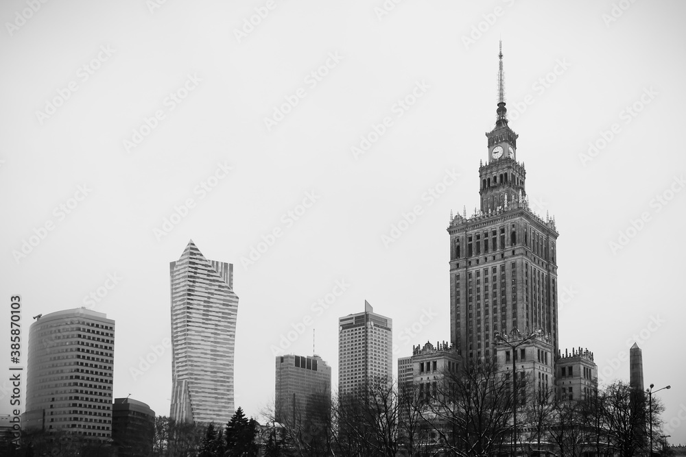 Black and white photography of Warsaw's skyline with the palace of Culture and Science and other modern skyscrapers
