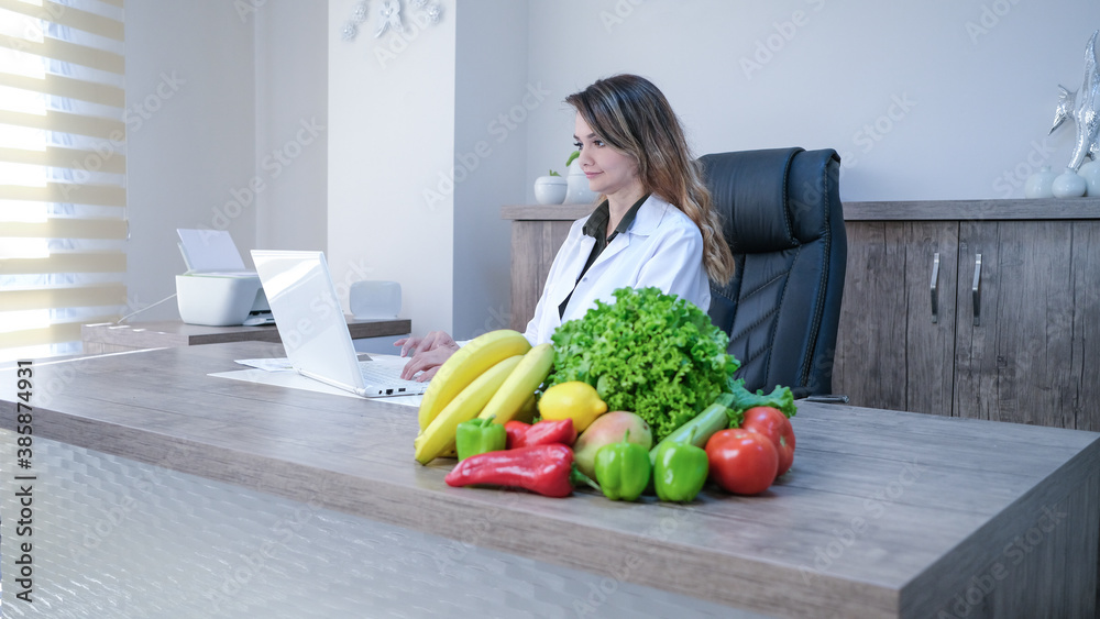 Dietitian doctor working in her office Dietitian doctor working in her office