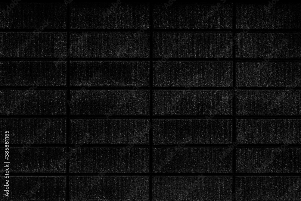 Naklejka premium Black cement block fence seamless background and pattern