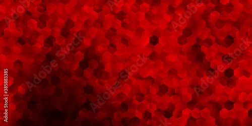 Dark red, yellow vector backdrop with chaotic shapes.