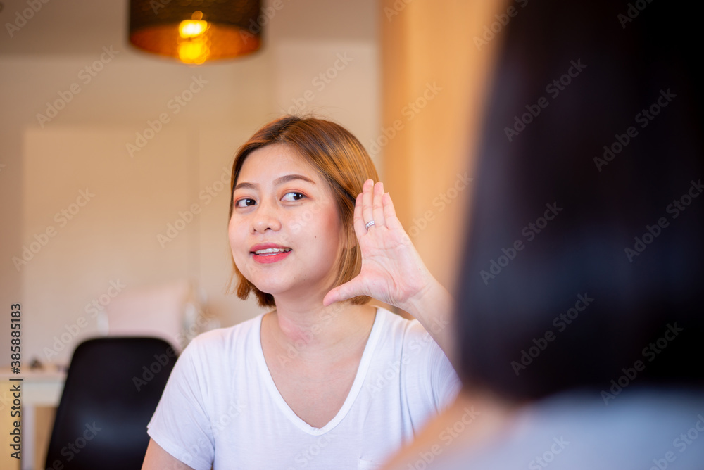 Asian woman patient deaf hearing talking with specialist sign language and showing hands gesture Asian woman patient deaf hearing talking with specialist sign language and showing hands gesture