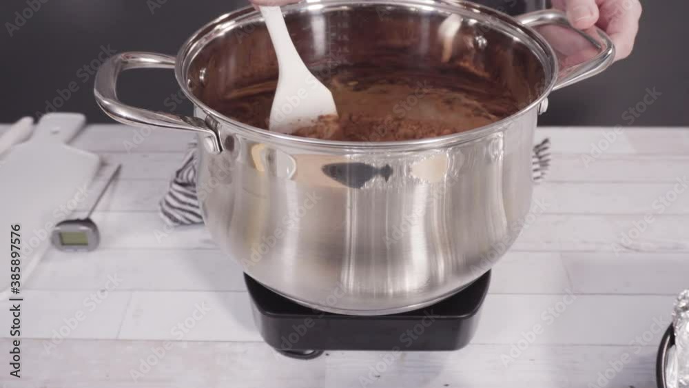 Step by step. Mixing ingredients in the cooking pot to make simple chocolate fudge. Step by step. Mixing ingredients in the cooking pot to make simple chocolate fudge.