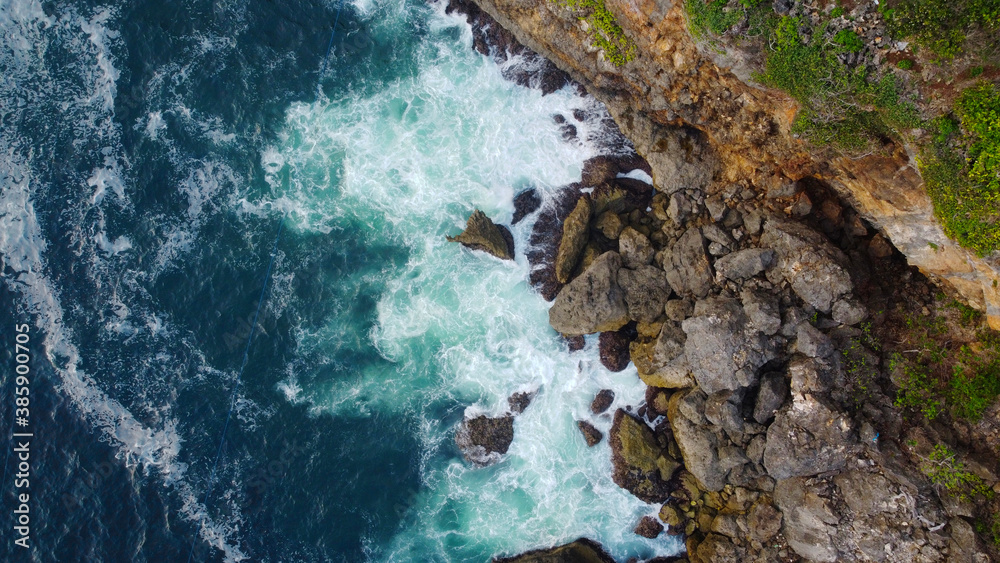top view of beautiful waves crashing the cliffs top view of beautiful waves crashing the cliffs