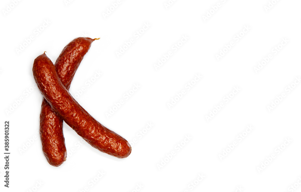 Creative layout of pinkel, a smoked kaszanka sausage, Cabanossi isolated on white background. Food concept. Flat lay and copy space for text Creative layout of pinkel, a smoked kaszanka sausage, Cabanossi isolated on white background. Food concept. Flat lay and copy space for text