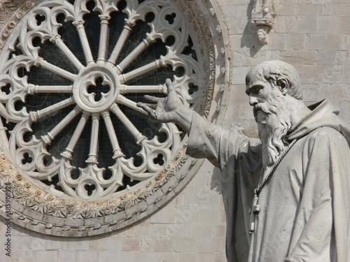 Medieval cathedral in Norcia, Italy with the statue of St Benedict