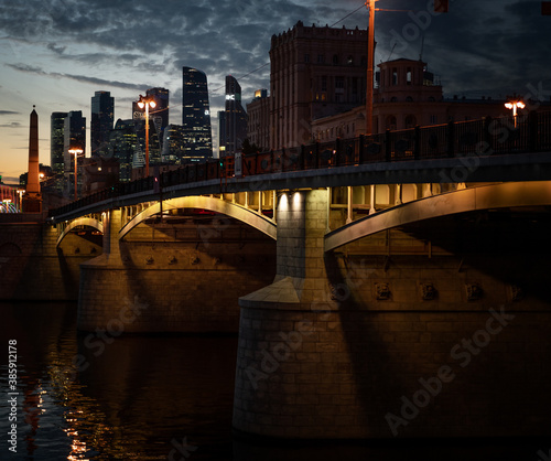 Beautiful city landscape. Moscow is the capital of Russia. View of the river and city bridge at night