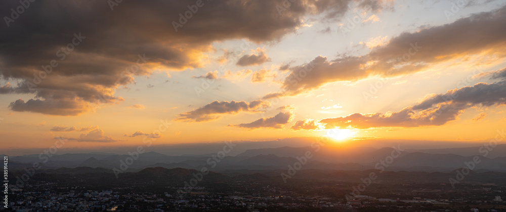 City from the viewpoint on top of the sunset behind mountain take a photo of Loei Thailand from Phu Bo Bit mountain peak