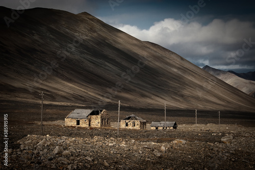 The ruins of the buildings of the Chukotka Forced Labor Camp, which was part of the Gulag. The prisoners built the Egvekinot-Iultin highway from 1946 to 1951. Chukotka, Siberia, Far East of Russia. photo