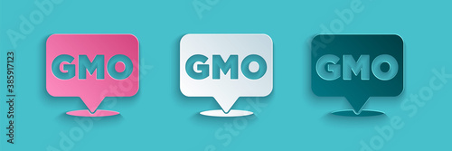 Paper cut GMO icon isolated on blue background. Genetically modified organism acronym. Dna food modification. Paper art style. Vector.