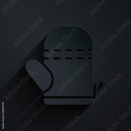 Paper cut Oven glove icon isolated on black background. Kitchen potholder sign. Cooking glove. Paper art style. Vector.