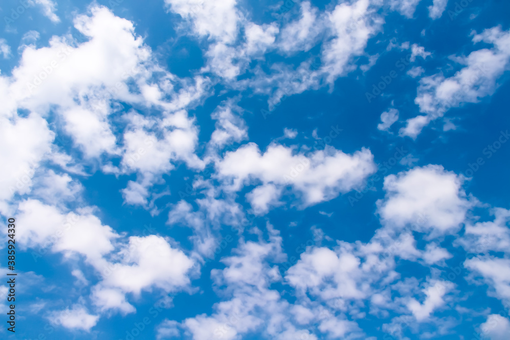 White clouds on bright blue sky outdoor summer background White clouds on bright blue sky outdoor summer background