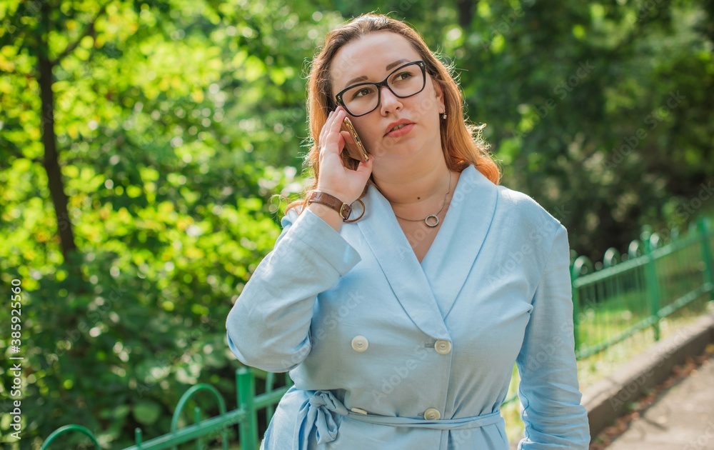Portrait of American plus size businesswoman in light blue suit, citizen lifestyle, concept of women's life Portrait of American plus size businesswoman in light blue suit, citizen lifestyle, concept of women's life
